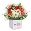 A burst of happiness emerges from this expertly arranged bouquet, reflecting the joyful spirit of Chase Cross. Frilly coral and rich red carnations bring warmth and vitality, while clusters of crisp white daisies with golden-green centres seem to beam with cheerful energy, reminiscent of vibrant front gardens along Chase Cross Road. Airy baby's breath floats delicately between the bolder flowers, adding a light, whimsical touch, while outlines of purple-tipped buds hint at the anticipation of seasons yet to come. Lush, glossy green leaves encircle the bouquet, wrapping the colourful blooms in a soothing embrace, and every stem is positioned with an eye to movement and fullness-a testament to the skill of local florists. Nestled inside a clean, square white gift bag with practical ribbon handles, the arrangement is designed for both elegance and easy delivery, perfect for birthdays, thank-yous, or uplifting someone's day in RM5. The overall effect is bright, sincere, and full of promise, just like the community it's made to serve.